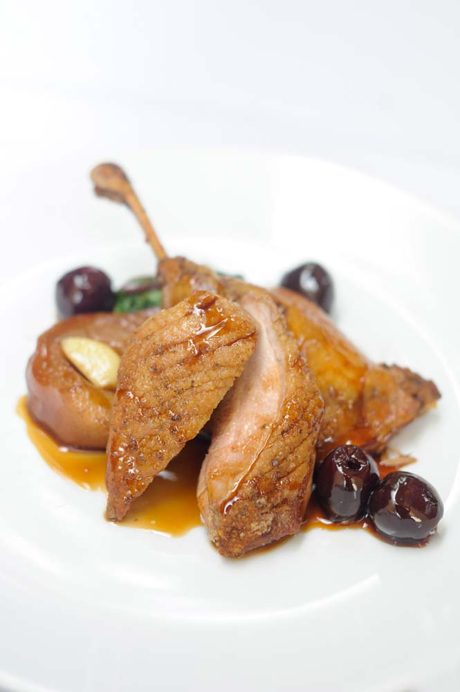 Pan seared duck breast, confit leg, pedro ximinez poached pear, stella cherries & star anise glaze